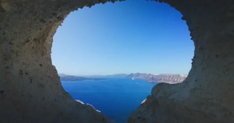 Large circular cave called the heart of Santorini near popular scenic Fira Stock Footage 201280667