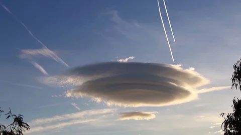 Large circular clouds (Altocumulus lenticularis duplicatus) Stock Footage 83589647