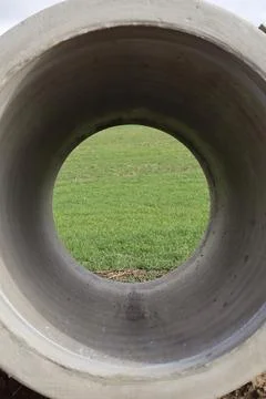 A large circular concrete pipe Foto stock