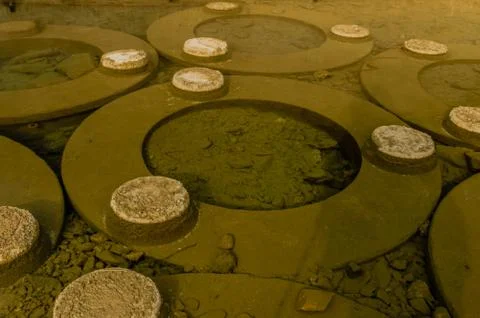 Large circular objects in river Stock Photos
