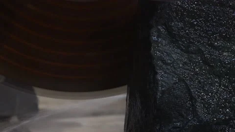 Large circular saw blade cuts stone Stock Footage 155095988