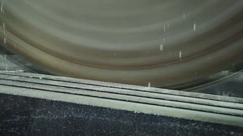 A large circular saw in a production facility cuts stoneware stoneware for thin Video stock 254061584