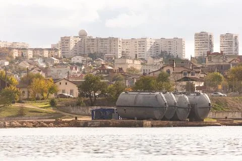 Large cisterns on the shore Stock Photos