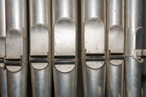 A large classical organ inside the Catholic Church.  A keyboard wind musica.. Stock Photos