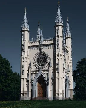 A large clock tower in front of a building Stock Photos