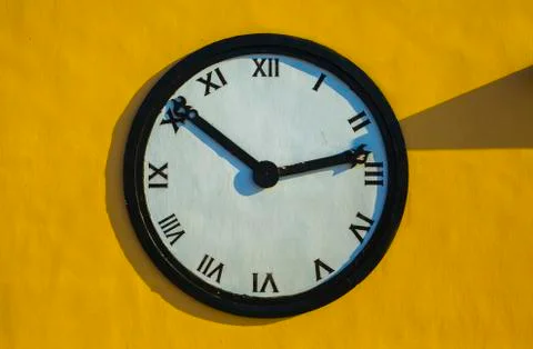 A large Clock on the wall colorful Stock Photos