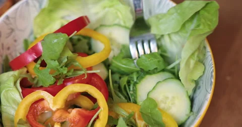 Large close-up of a vegetable salad in a deep bowl Stock Footage 232732653