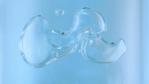 Large closeup Bubbles moving around in water, slow motion Stock Footage 92754294
