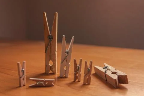 Large clothespin with small ones Stock Photos