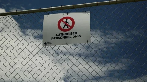 Large cloud and sign Authorised Personnel Only 4K Stock Footage 299457494