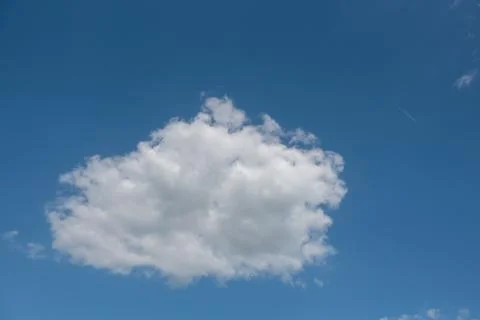 Large cloud in the bright blue sky Stock Photos