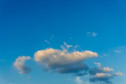 Large cloud on clear blue sky background with copy space for wallpaper. Stock Photos