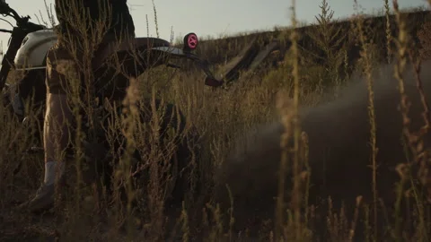A large cloud of dust and ground  from gassing the rear wheel of a motorcycle Stock Footage 253451529