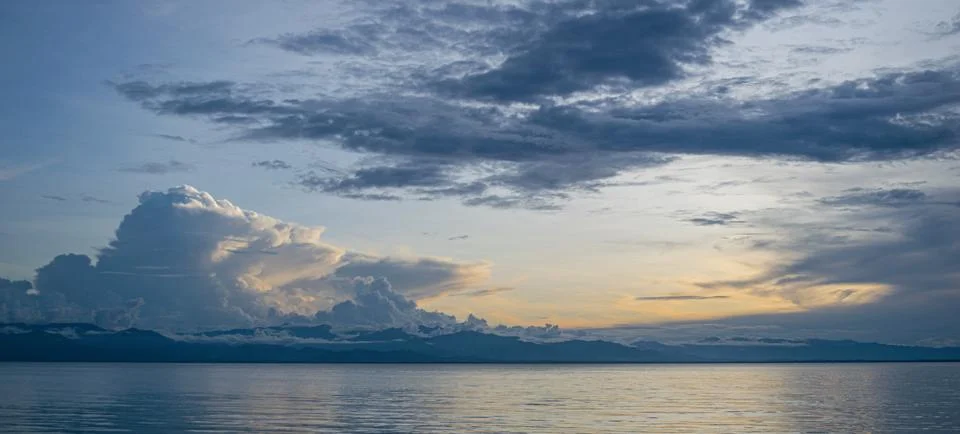 Large Cloud Formations over Mountains in Background Stock Photos