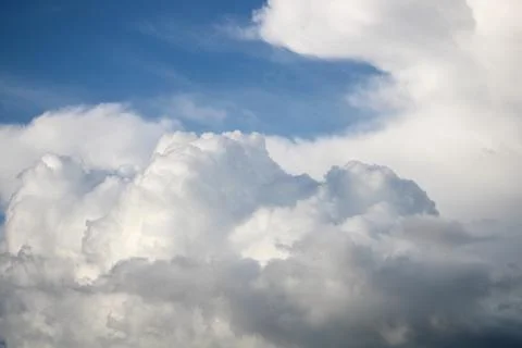 A large cloud that is in the sky. cumulus clouds. cumulonimbus Stock Photos
