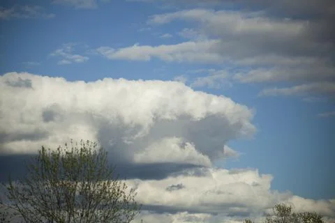 Large cloud in sky. Details of spring sky. Air mass. Stock Photos