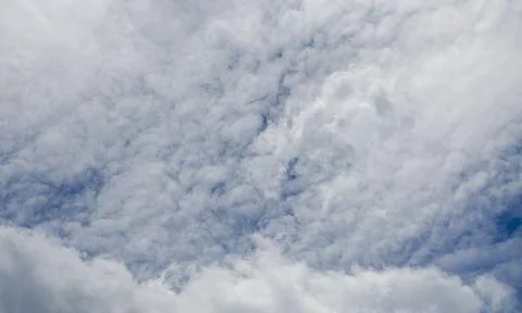 A large cloud of white clouds in the blue sky. Stock Photos
