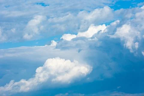 Large clouds and storm clouds close-up. Stock Photos
