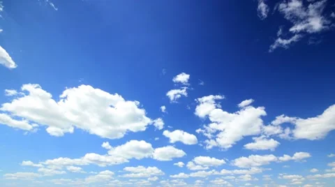 Large clouds slowly move together on blue sky day time lapse. Video stock 8423568