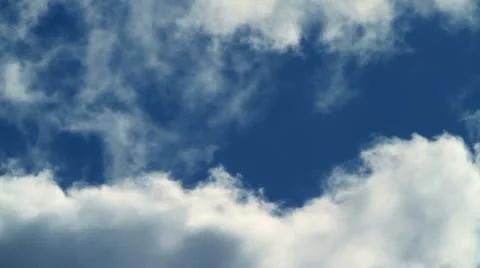 Large clouds slowly move together on blue sky day time lapse. Stock Footage 10833935