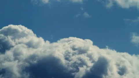 Large clouds slowly move together on blue sky day time lapse. Stock Footage 10833961