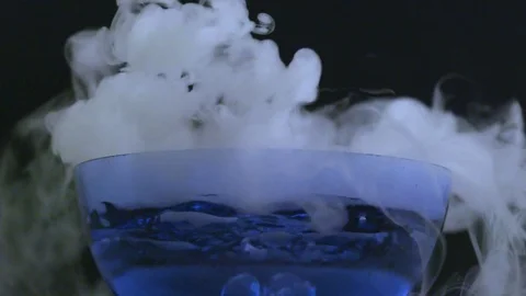 Large clouds of smoke in a bubbling bowl in slow motion Stock Footage 70705570