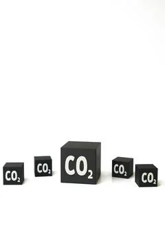 Large CO2 cube with smaller cubes on a white background. Concept of carbon in Stock Photos