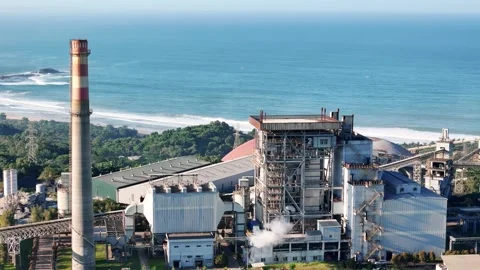 Large coastal power facility symbolizing energy industry, electricity generation Video stock 342958794