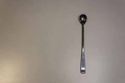 Large cocktail spoon on a white background. Bar equipment Foto stock