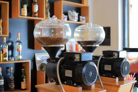 Large coffee grinder in a cafe 库存照片