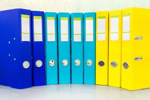 Large color folders for documents on the table in office, close-up, copy spac Stock Photos