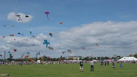 Large colourful kites dancing in the wind  kite festival Stock Footage 145875950