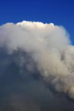 A large column of smoke from a fire Stock Photos