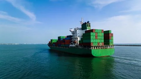 Large Commercial Container Ship Transporting Cargo Across Open Sea In Si Ra.. Stock Photos