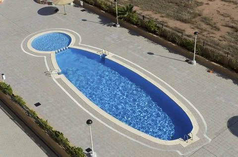 Large communal irregular pool with crystal clear water Stock Photos