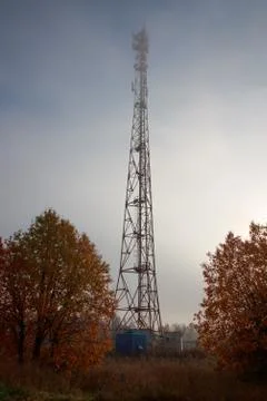Large communication tower in the daytime view from the outside Stock Photos