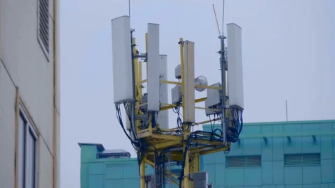 A large complex of antennas mobile communication and internet in the city Stock Footage 229825618