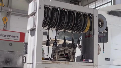 Large compressor pumping unit with hoses for tire inflation and pressure testing Stock Footage 261286085