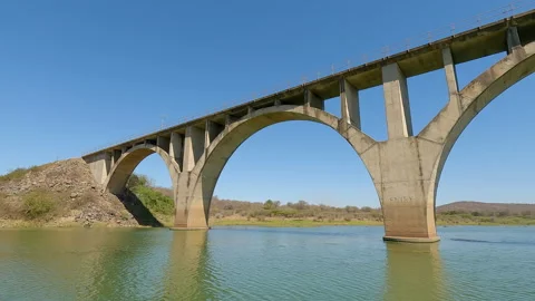 A large concrete bridge stretching over a river Stock Footage 288199549
