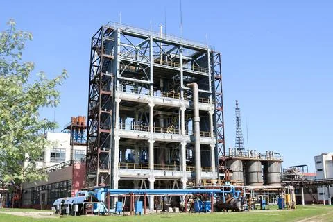 A large concrete technological industrial installation at a chemical petroche Stock Photos