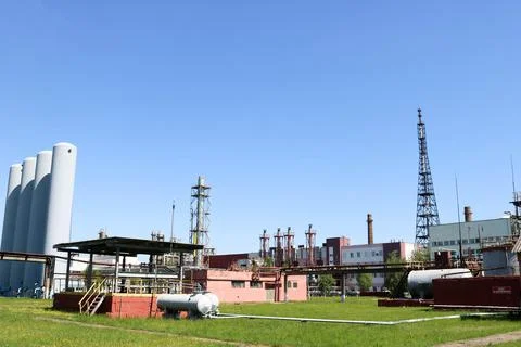 A large concrete technological industrial installation at a chemical petroche Stock Photos