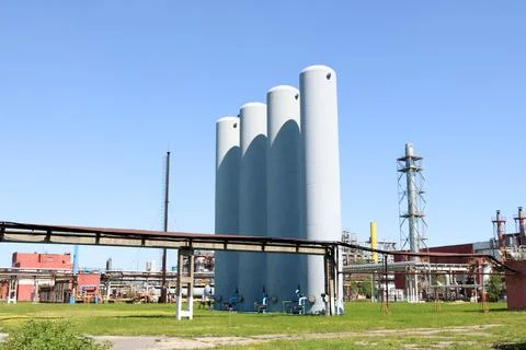 A large concrete technological industrial installation at a chemical petroche Stock Photos
