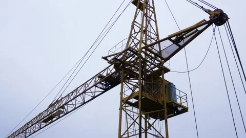 Large construction crane against the blue sky Stock Footage 228820867