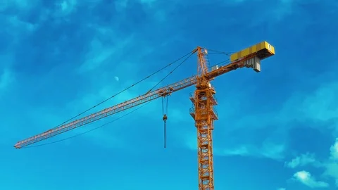 Large construction crane. Clear blue (birch) sky. Background UHD 4K 60FPS Stock-Footage 113262079