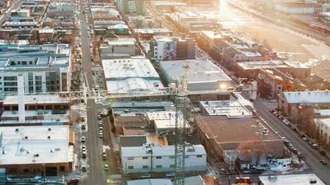 Large construction crane at development site at sunset Stock Footage 123140770