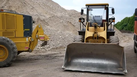Large construction equipment is on construction site. Loader, grader, dump truck Stock Footage 144244601