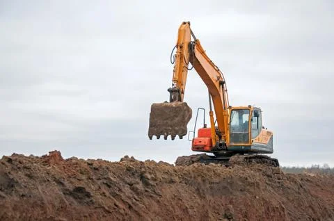 Large construction excavator at construction work. Special machinery Stock Photos