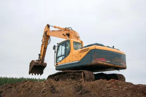 Large construction excavator at construction work. Special machinery Stock Photos
