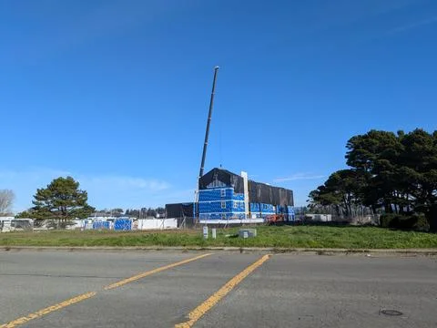 Large construction project with crane above building Stock Photos