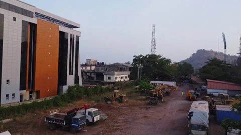 A large construction site adjacent to a newly built office building in Abuja Vídeos de archivo 329199470